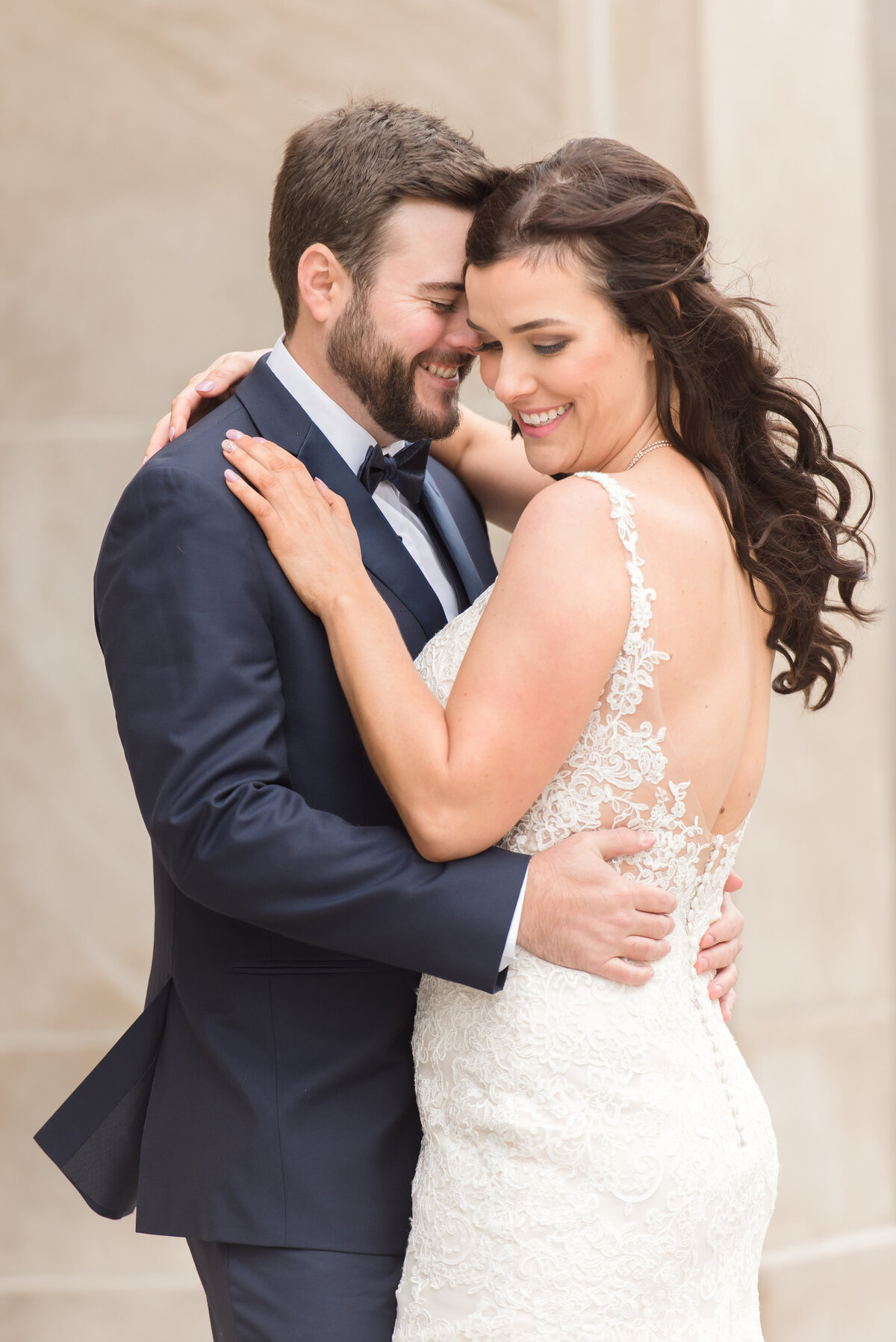 a close up of a couple embracing each other in Grand Rapids, Michigan