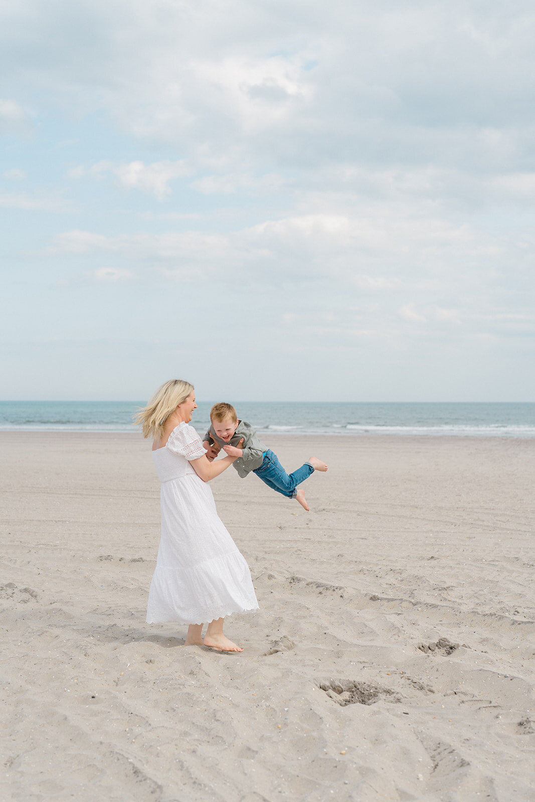 Mom and son playing on the beach in Ocean City, NJ