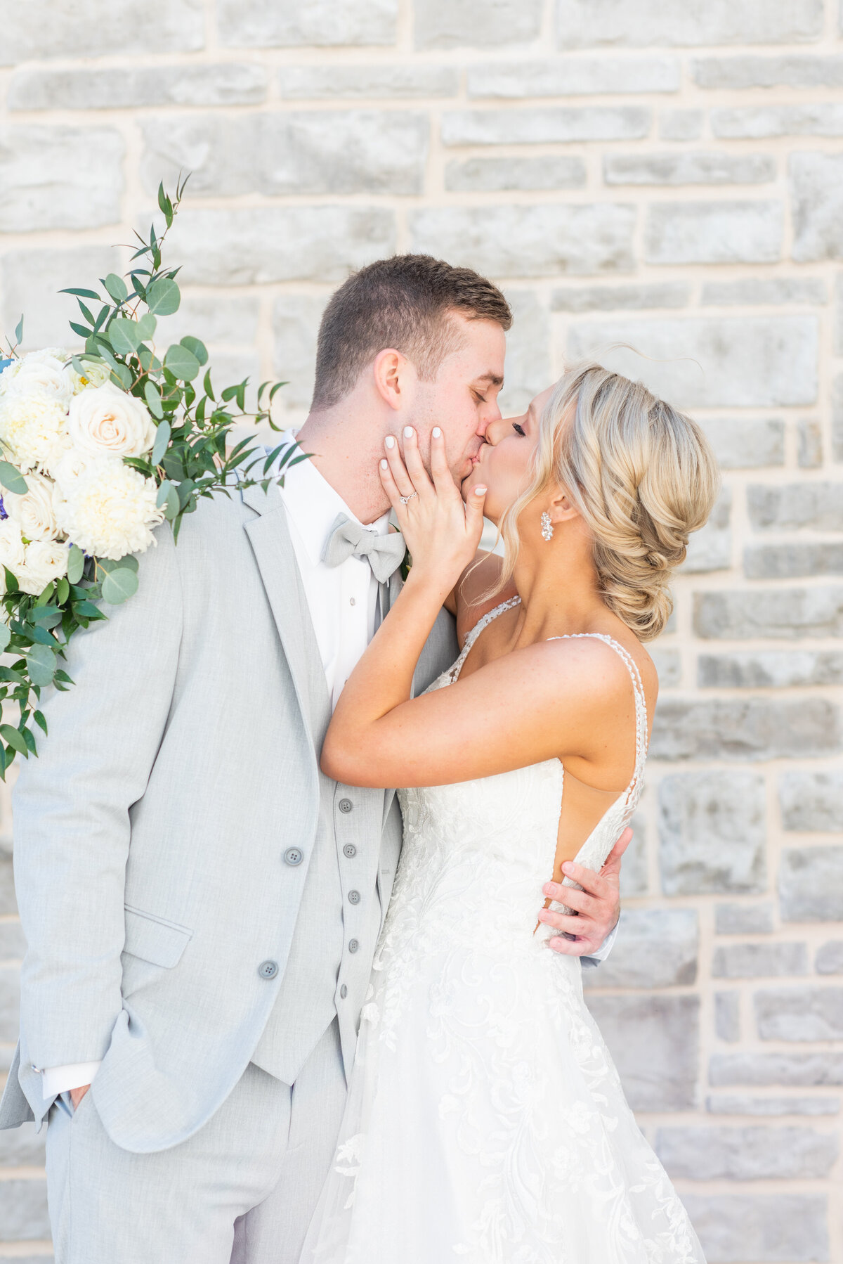 bride and groom kissing