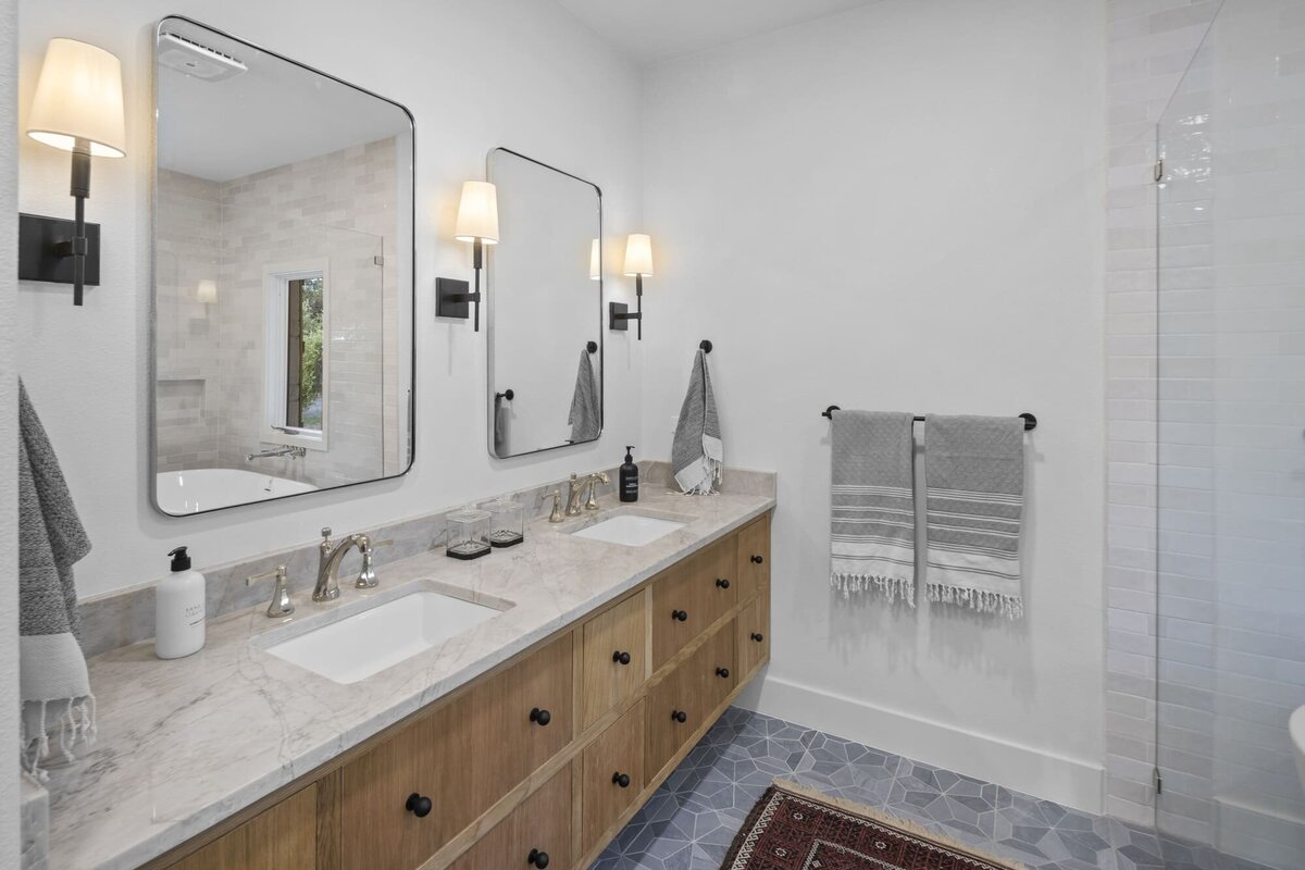 bathroom with double basin and 2 mirrors