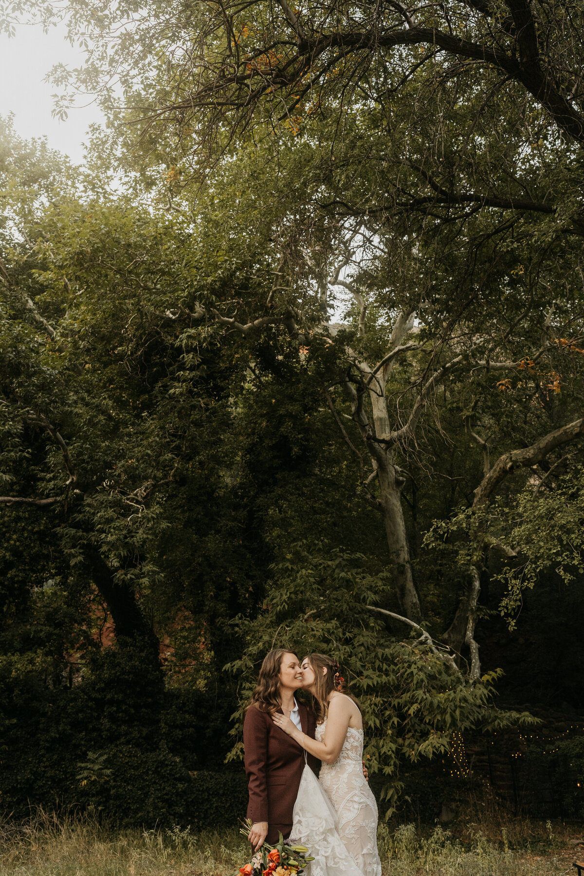 A person kissing their partner on the cheek 