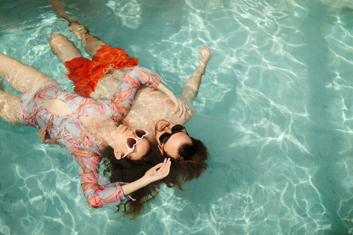 vintage-retro-couples-photoshoot-engagement-session-swimming-pool-floaties-floats-sunglasses-30A-florida-2