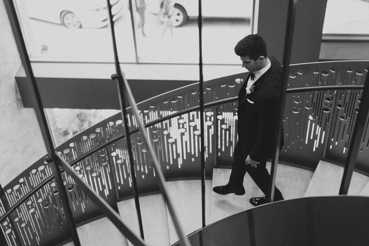 groom walking down stairs on lancaster wedding day