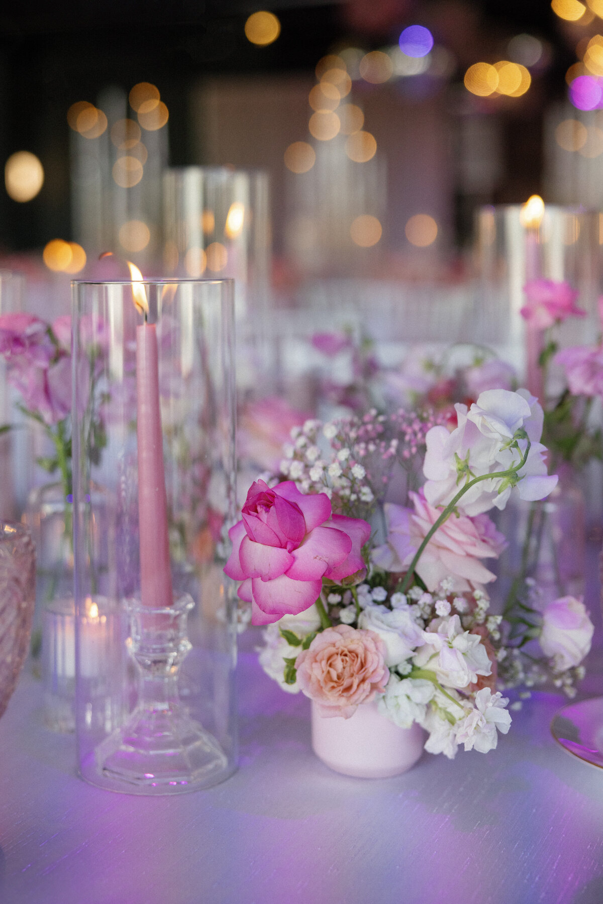 pink themed table yop at wedding reception