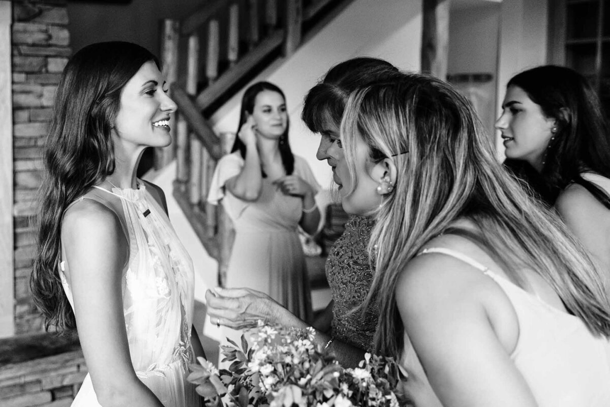 Bridesmaids looking at bride's jewelry in Big Sky, Montana