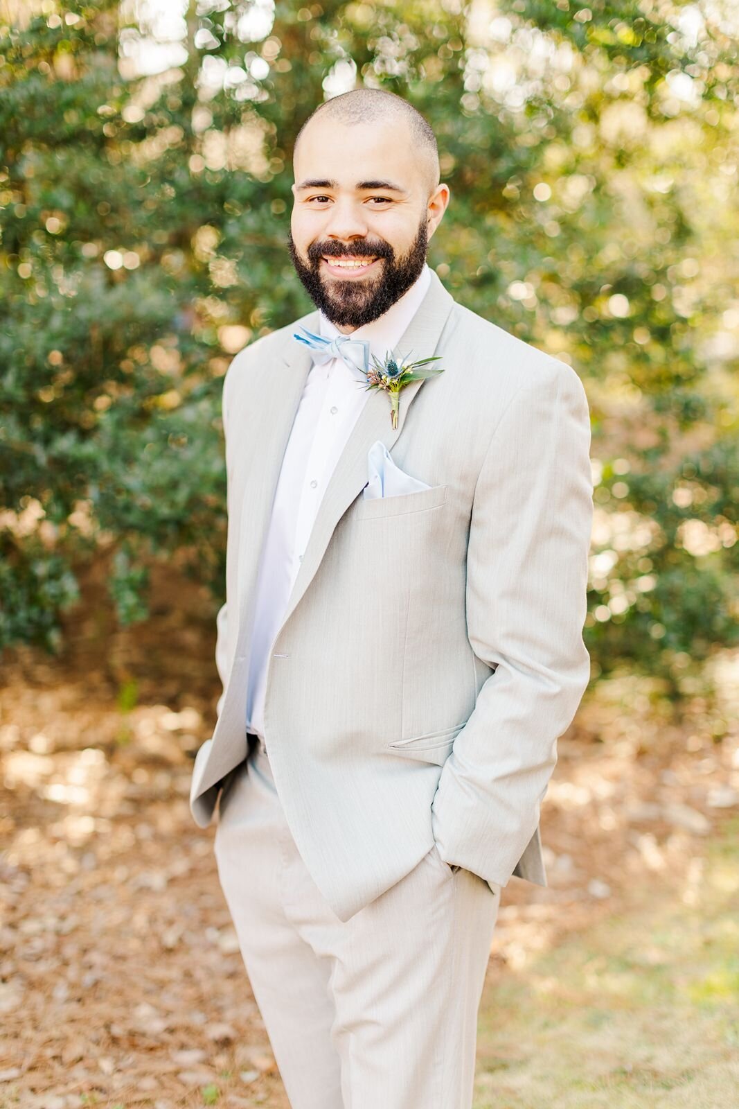 Handsome groom poses for portrait