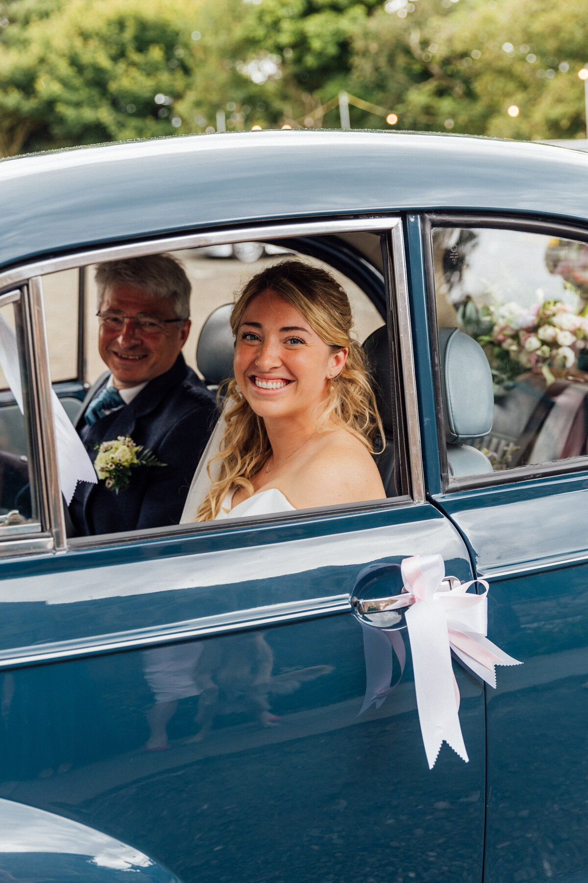 Bride arriving in classic car at The Free Comapny wedding