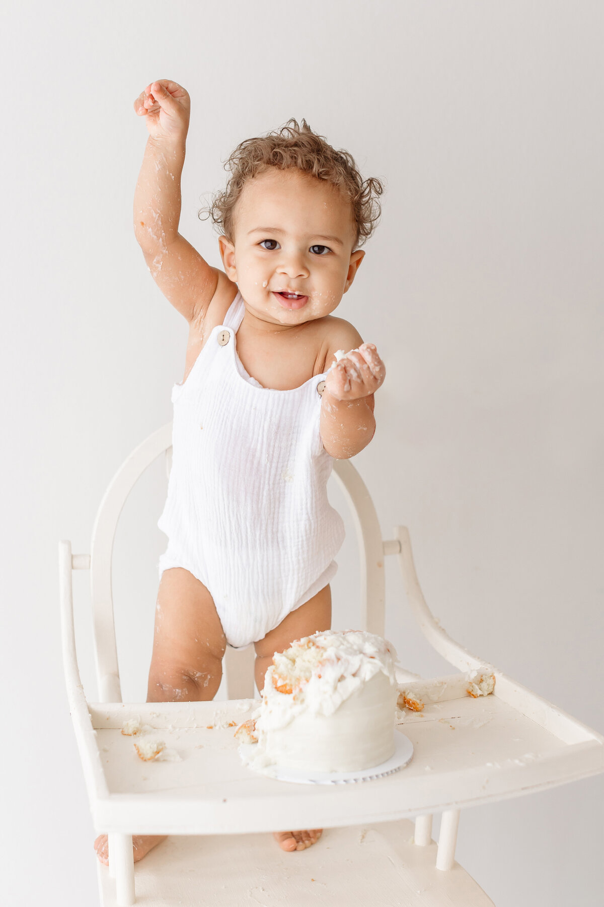 toddler standing on high chair