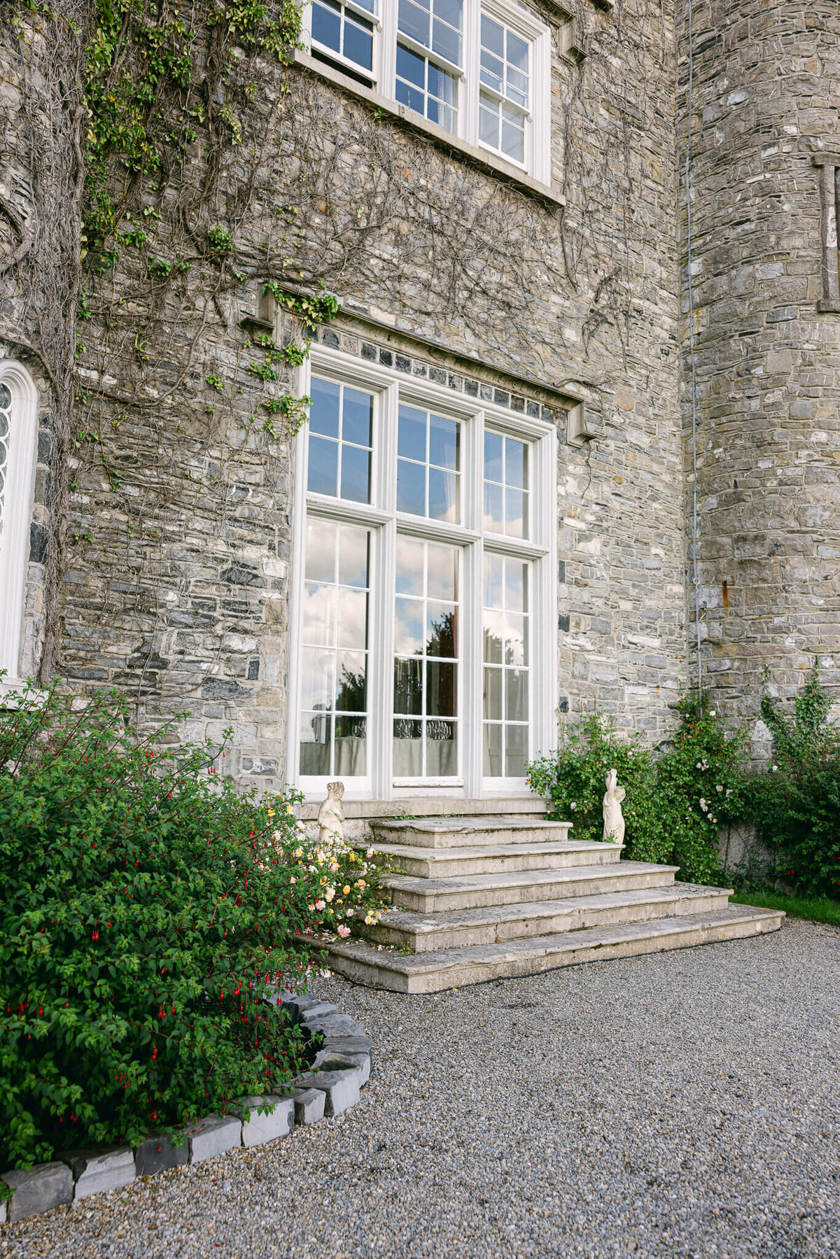 A wedding photo of guests during cocktail hour at Luttrellstown Castle in Ireland