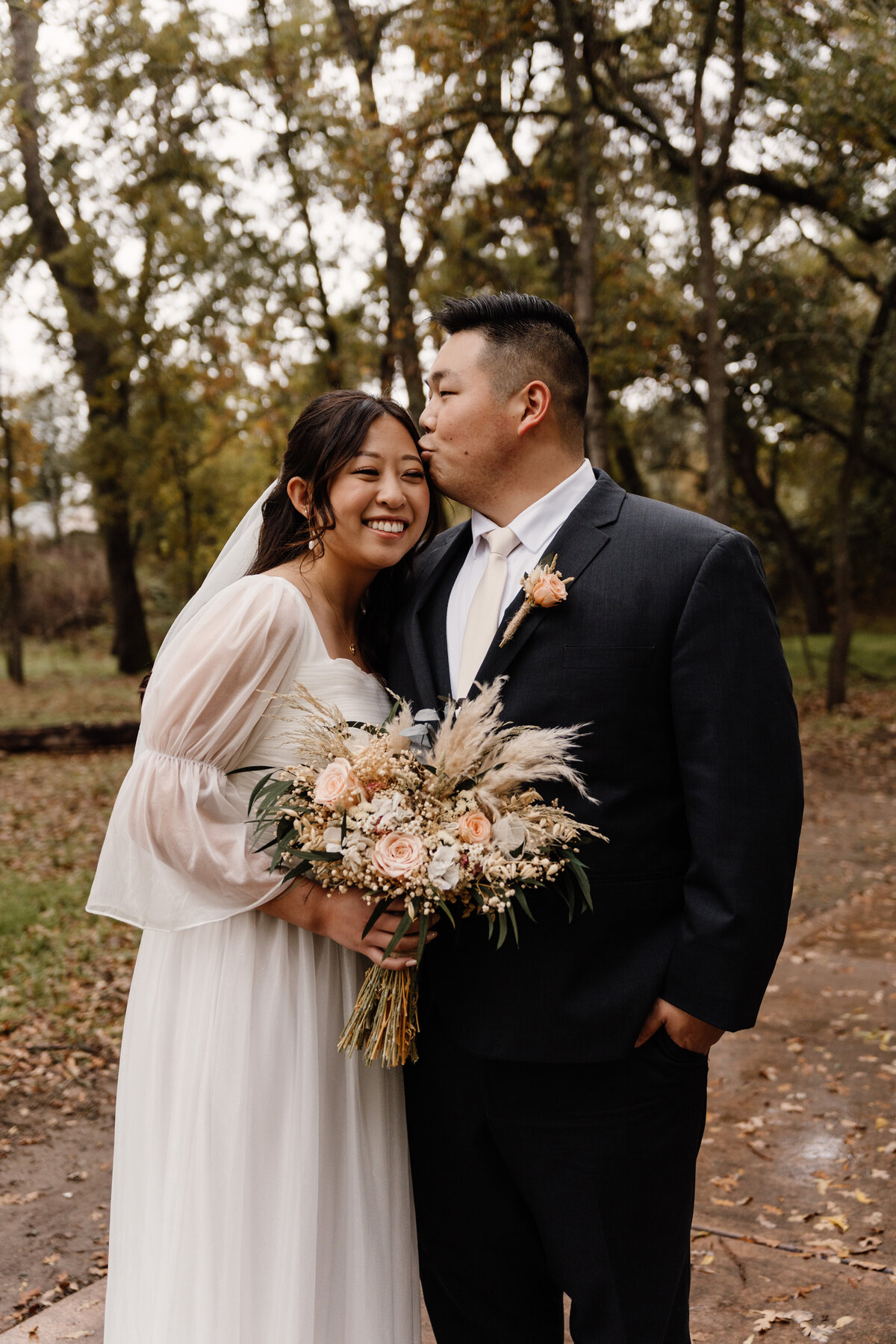 groom kisses bride in sacramento