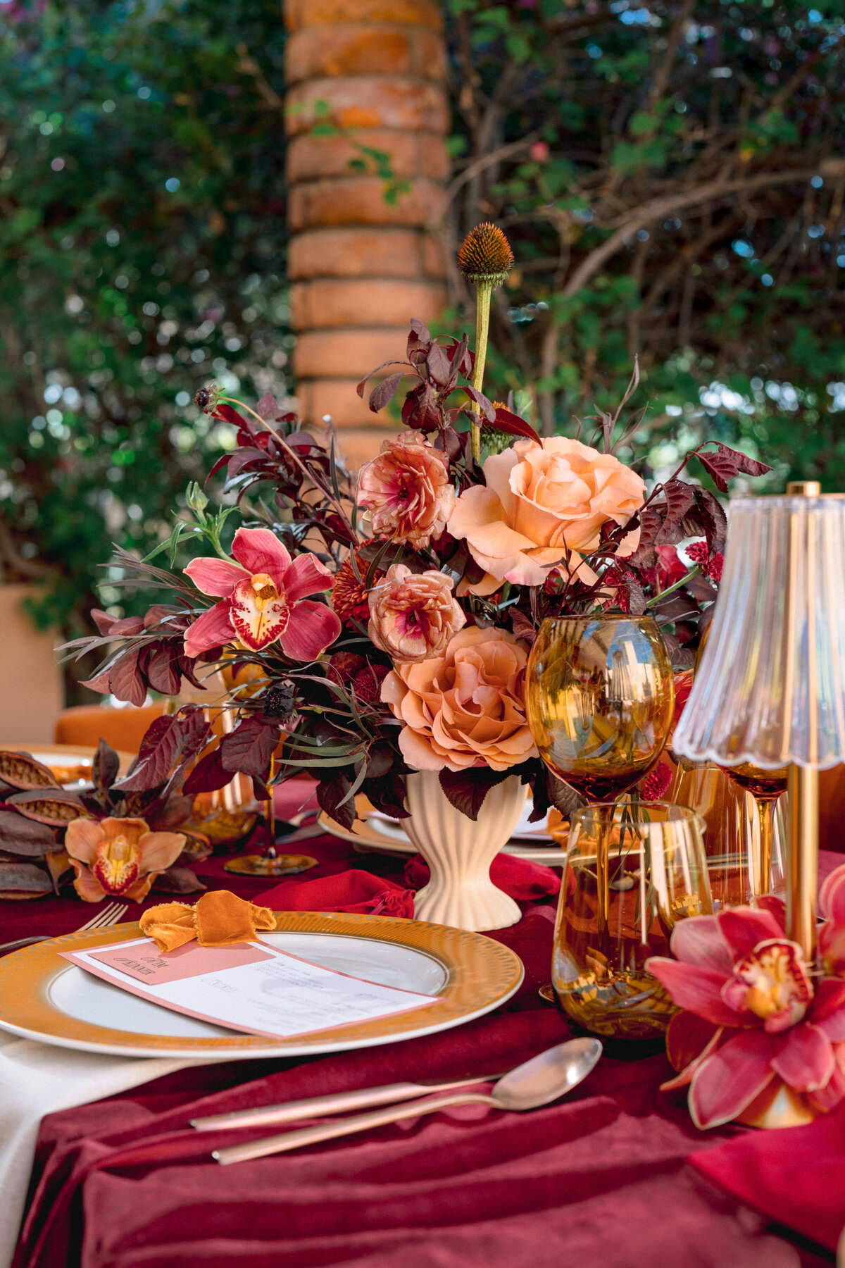 Floral arrangement centerpiece in rich warm colors for a fall wedding at Royal Palms Resort in Scottsdale, AZ by Snapdragon Bloom Bar.