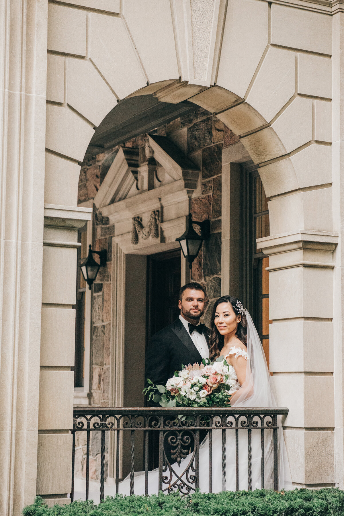 Luxurious bride and groom portraits on exquisite balcony