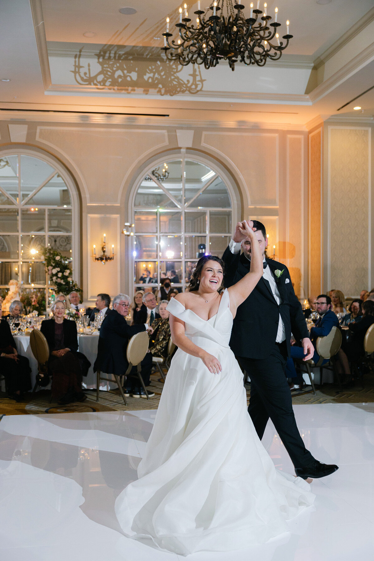 bride and groom sharing their first dance at The Adolphus in Dallas, capturing a romantic and elegant wedding moment on the dance floor.