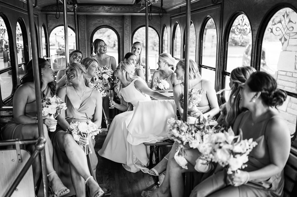 Bride with bridesmaids in trolley car