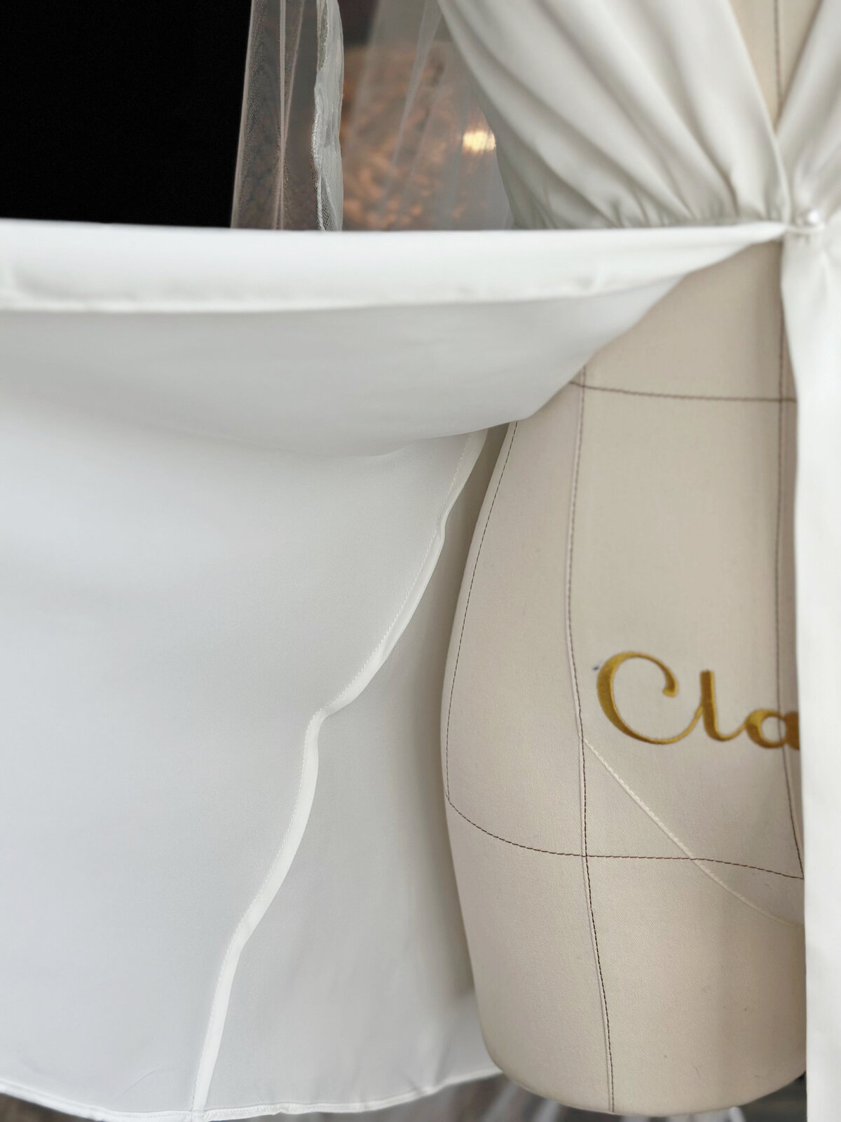 Bride wearing handmade satin slip dress with elegant open back
