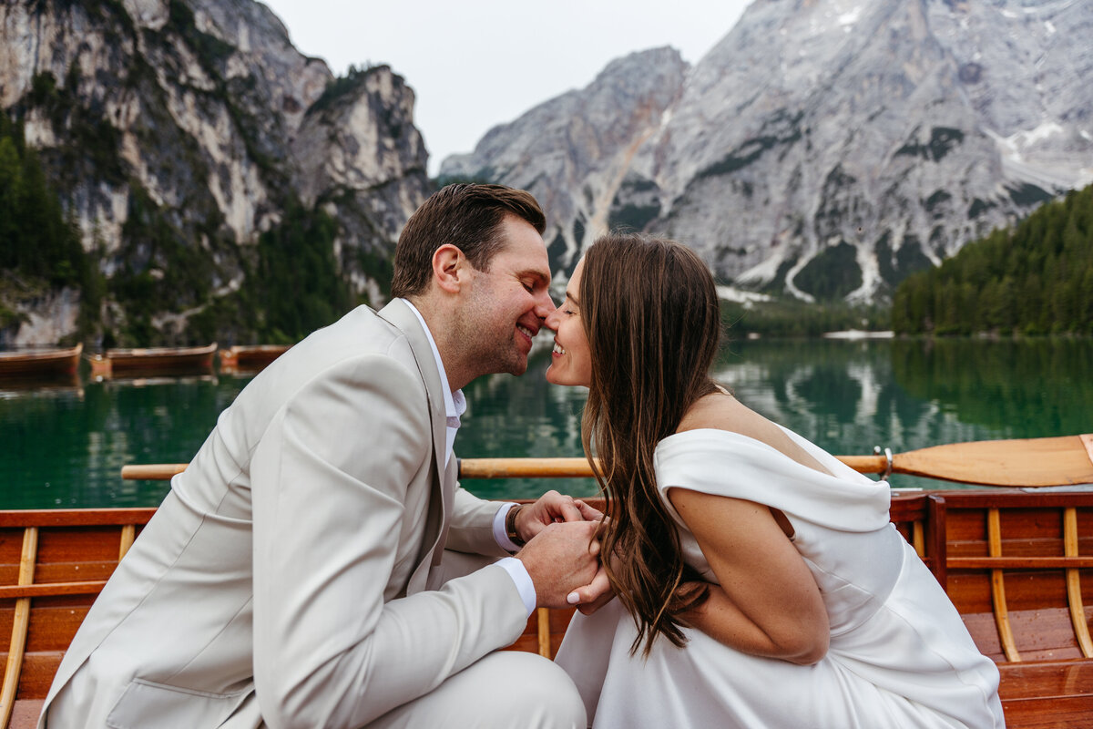 Bride and groom romantic rowboat Lago di Braies