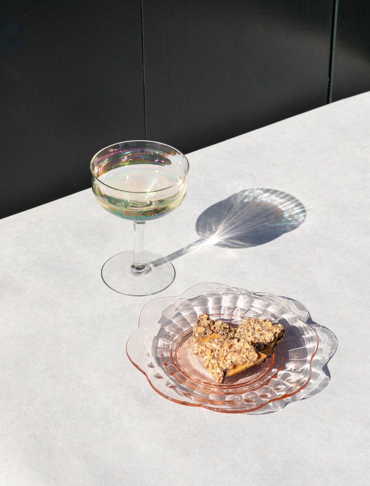 chocolate on a plate with a glass next to it