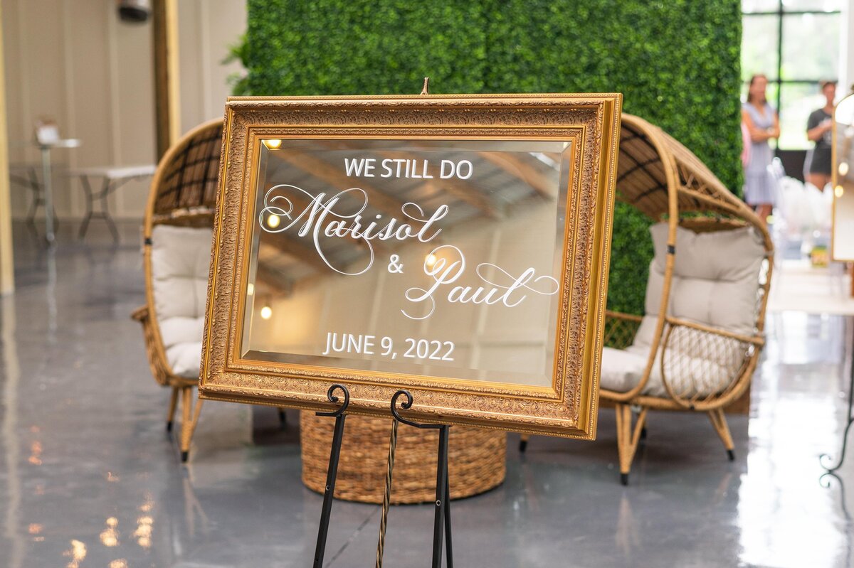 Medium gold mirror with ornate border with calligraphy for welcome sign