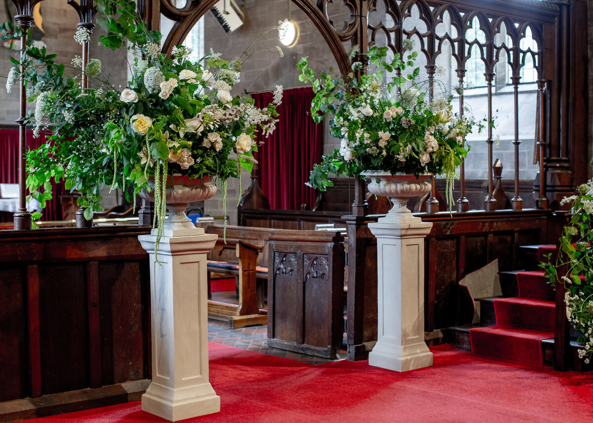 Wedding floral urns in traditional Church 