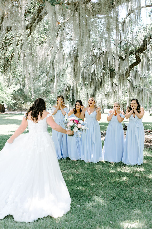 charleston wedding photographer bridesmaids first look at magnolia plantation