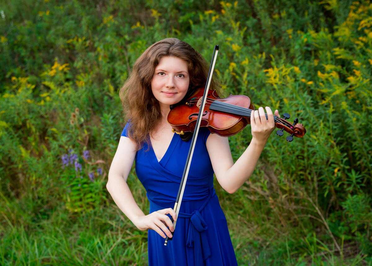 Girl playing violin in senior portrait near Penn Yan, NY