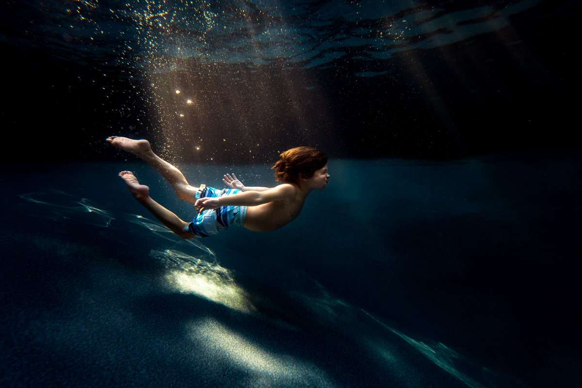 underwater photographer, columbus, ga, atlanta, pool, young boy swimming, sunrays, ker-fox photography 2