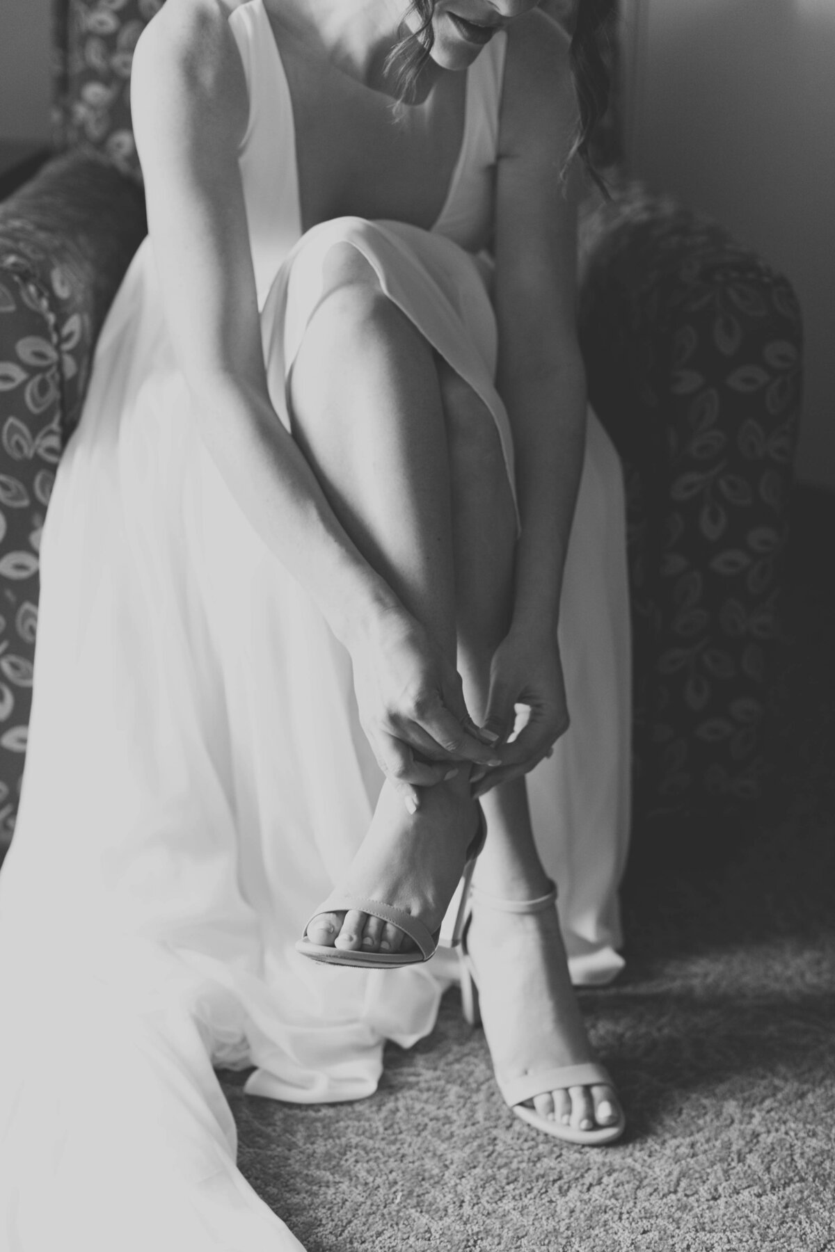bride putting on shoes