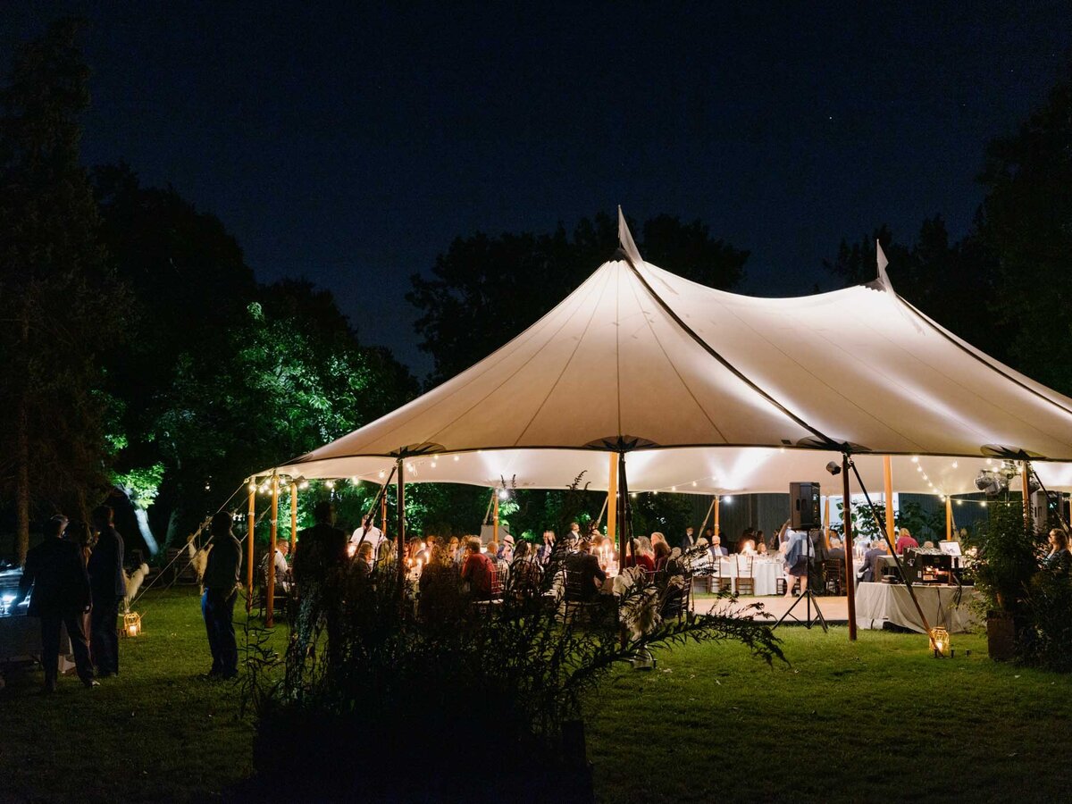 Elegant tented reception at private estate wedding.