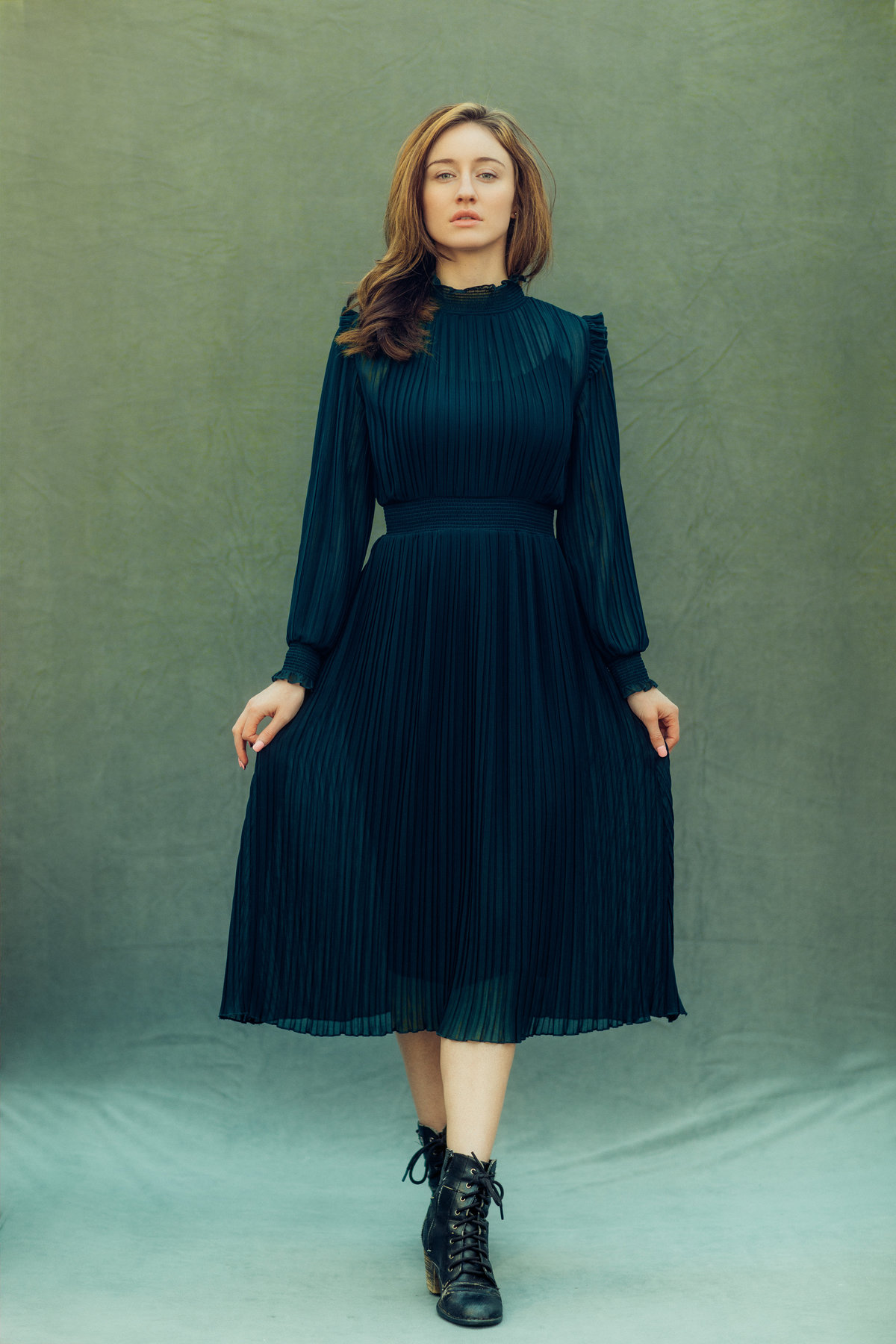 Portrait Photo Of Young Woman Holding Her Black Dress Los Angeles