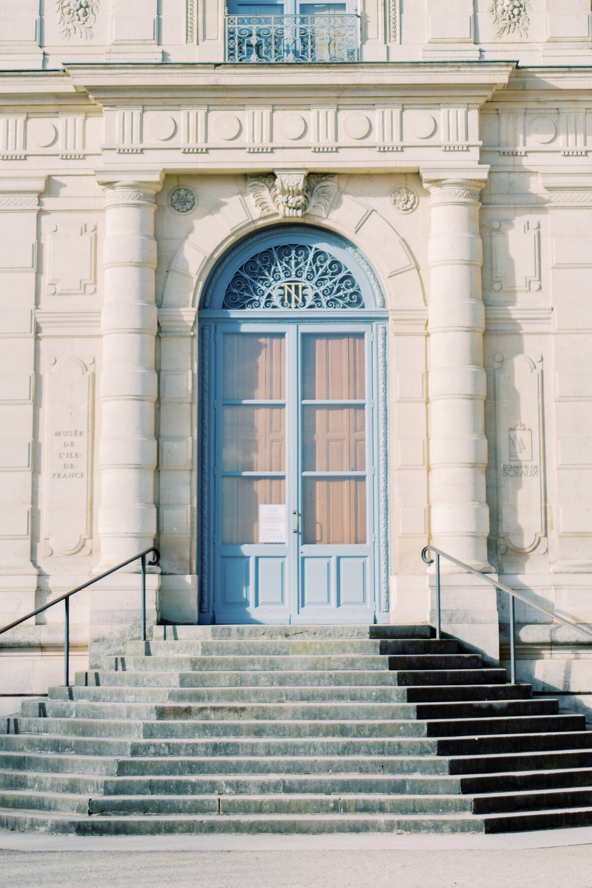 Blue door with the light coming on so beautifully at Chateau de sceaux