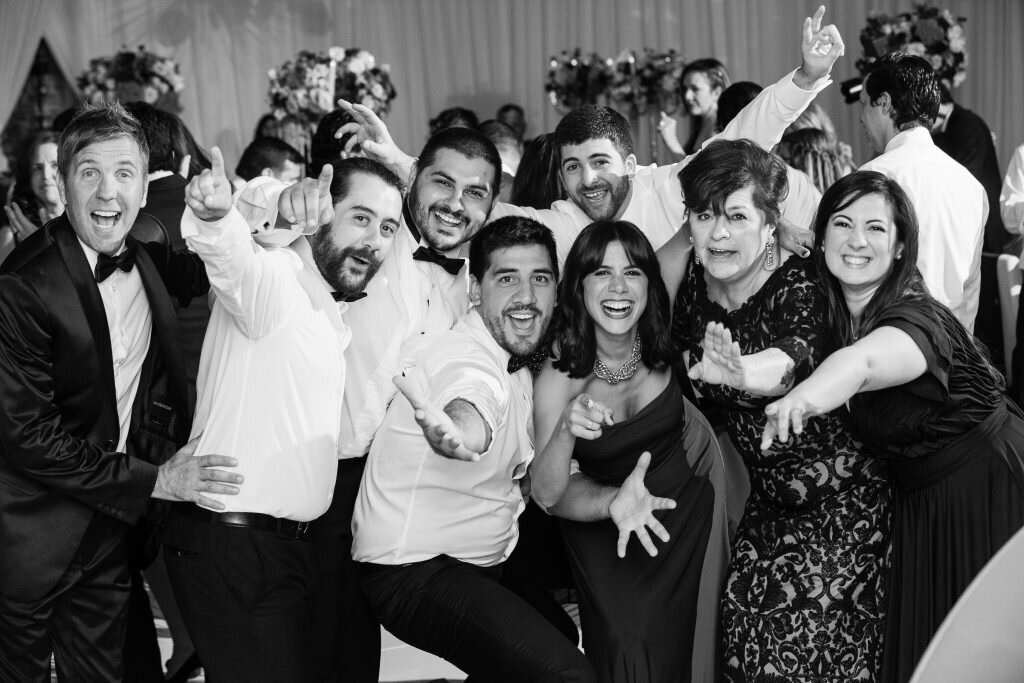 Black and white photos of wedding guests celebrating