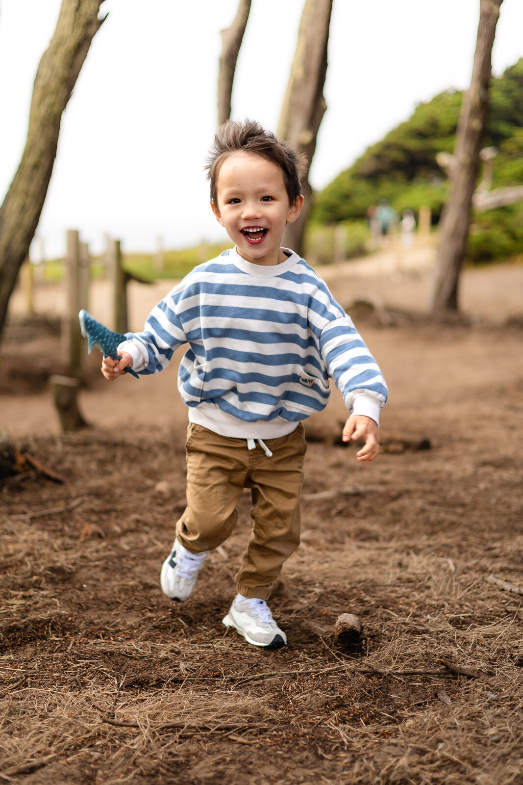 Little boy running and laughing outdoors during Bay Area school photography lifestyle session – Ellobelle Photography
