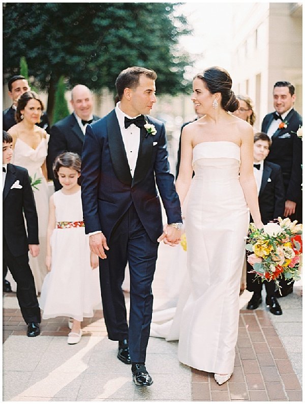 Bride and groom walking with their wedding party © Bonnie Sen Photography