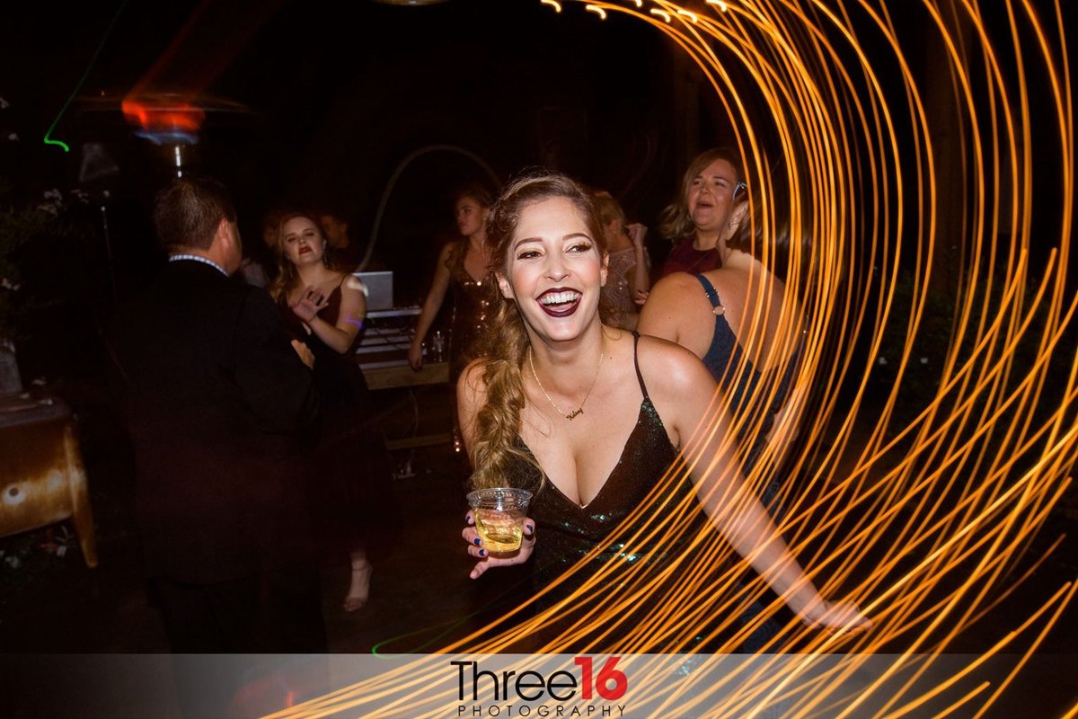 Woman with drink at Forever and Always Farm Wedding Venue