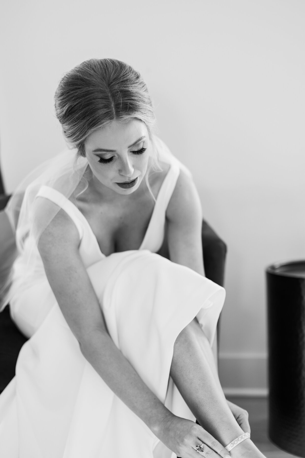 Bride adjusting shoes