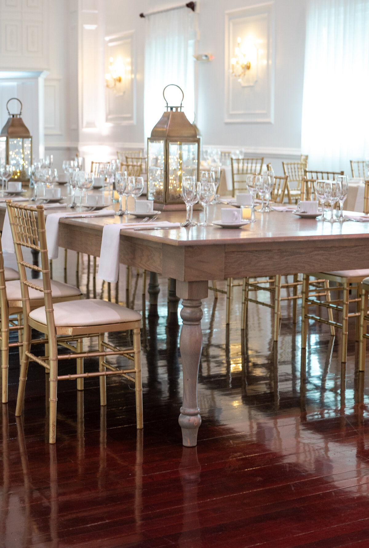 the lanterns and farmhouse wedding table seating at the hamilton manor new jersey