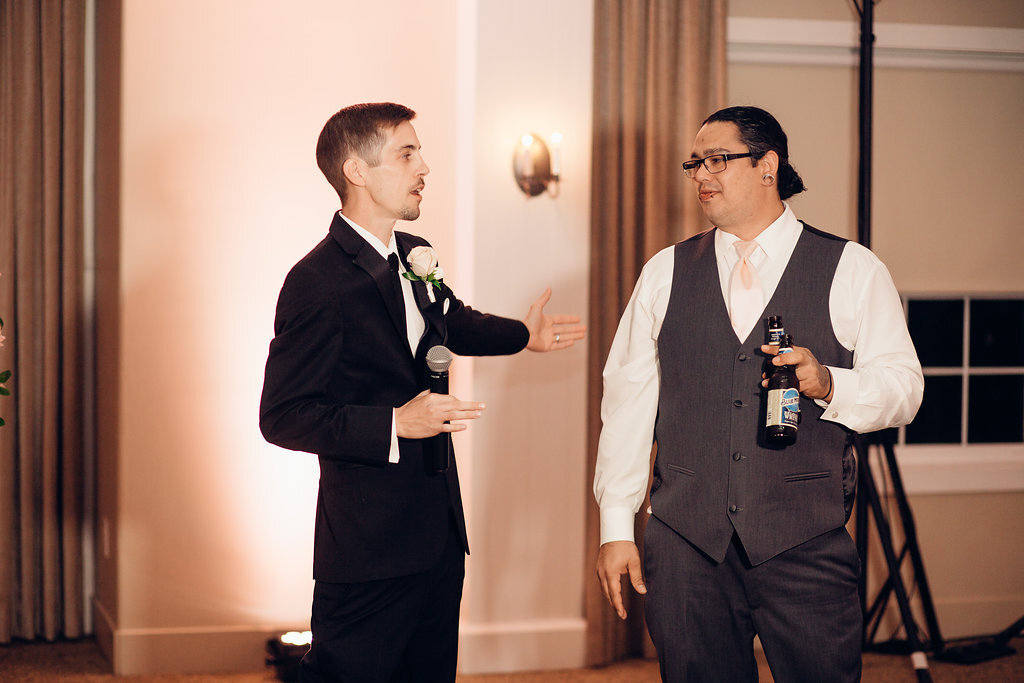 Wedding Photograph Of Groom Talking To a Man In Gray Suit Los Angeles