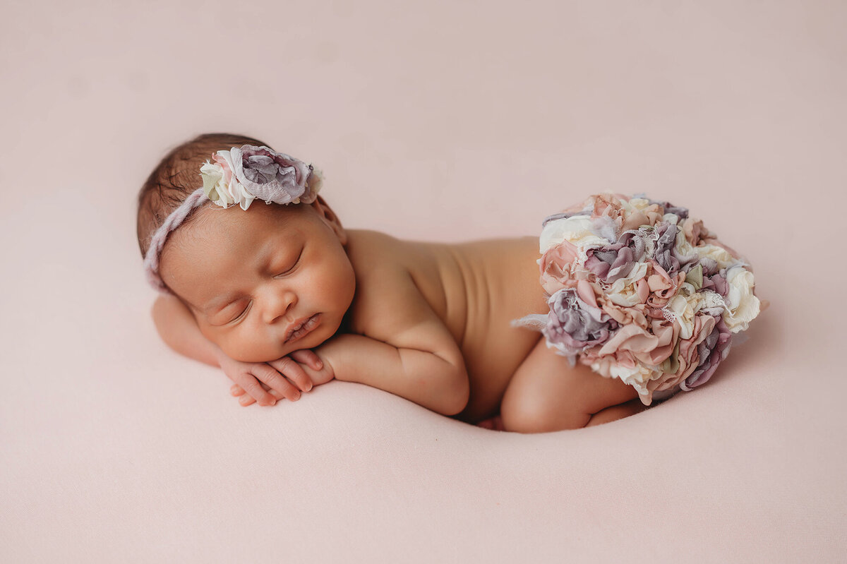 Baby girl posed for Newborn Portraits in Asheville, NC.