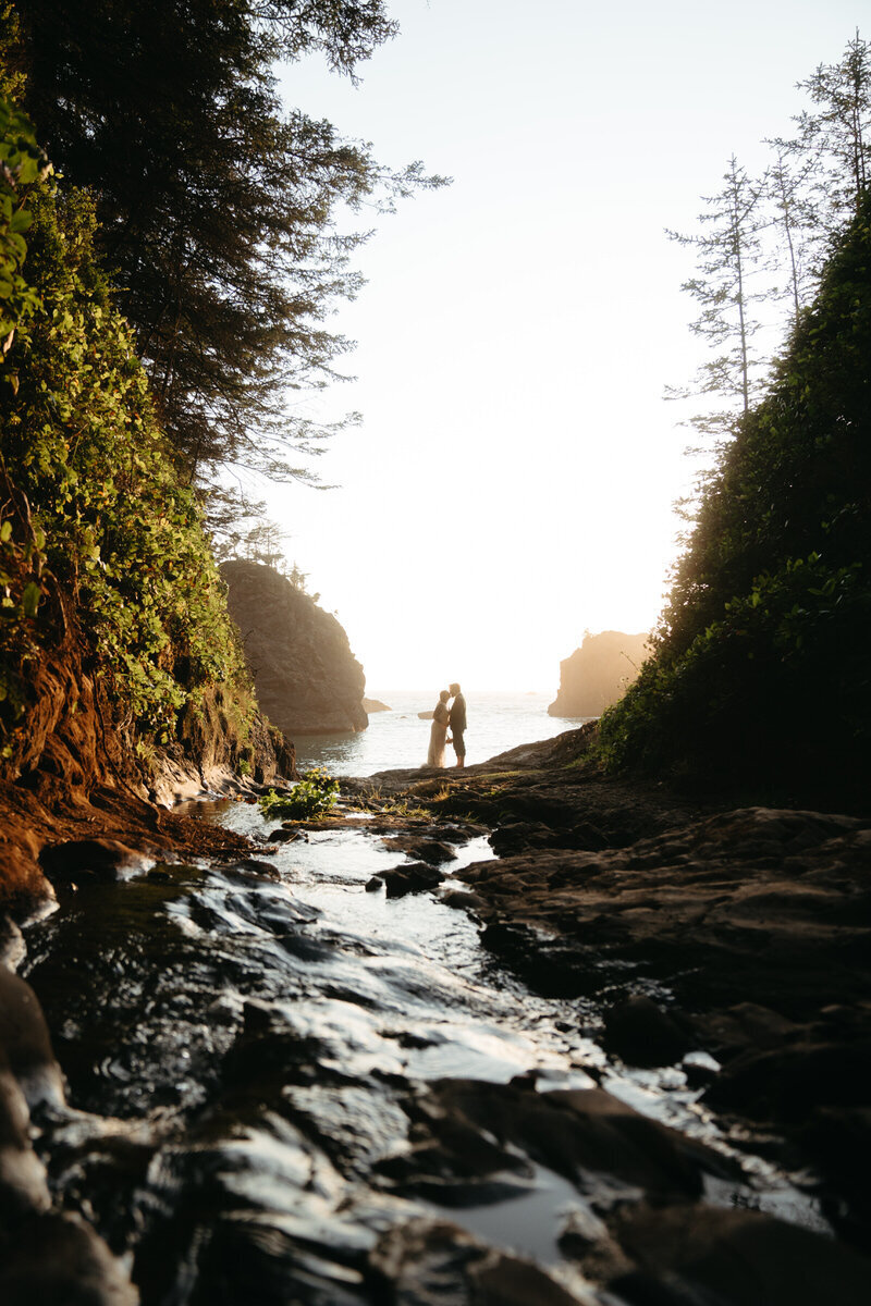 Eloping Ideas | Wedding couple holding hands walking through unique Scottish mountains