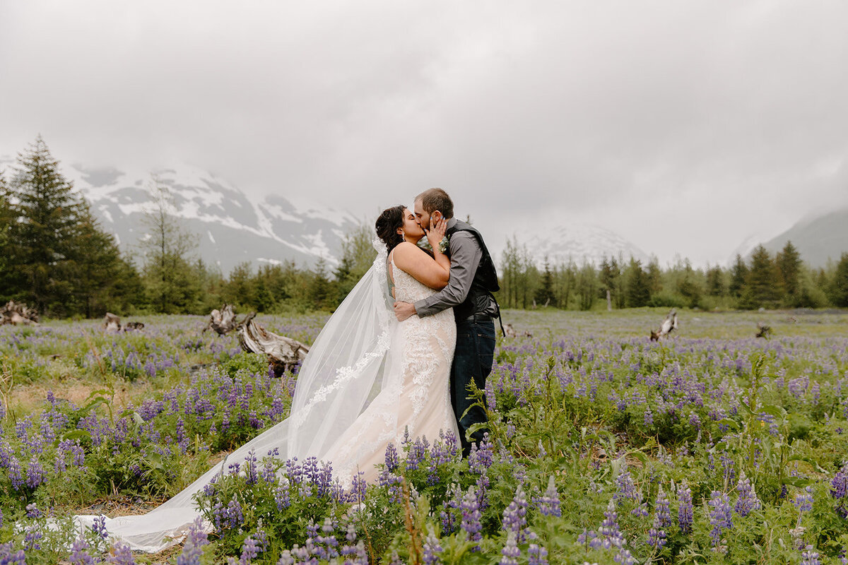 Alaska elopement couple shares their first kiss after saying vows.