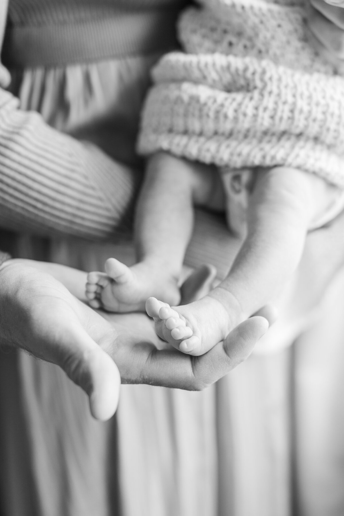 black and white close up of baby toes during a newborn session