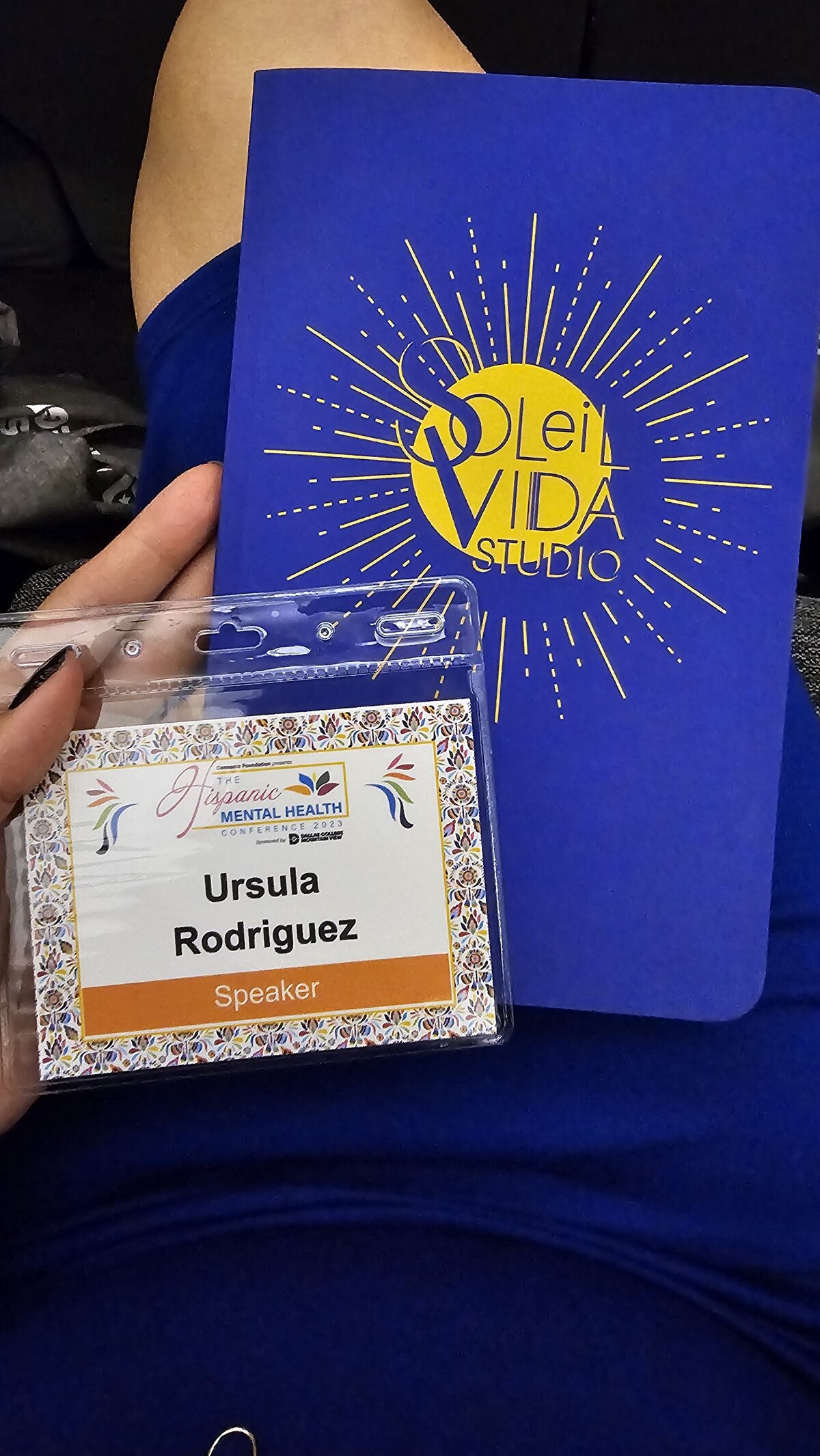 The charm of simplicity with a blue agenda featuring a bold yellow logo on its cover. Embrace organization with style, a perfect companion for your creative journey.