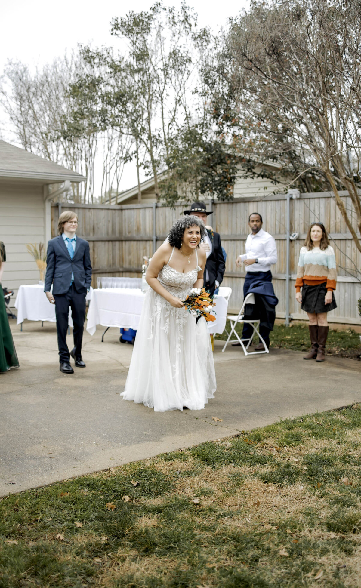 a bride gets ready to toss the bouquet at her micro wedding in dallas texas