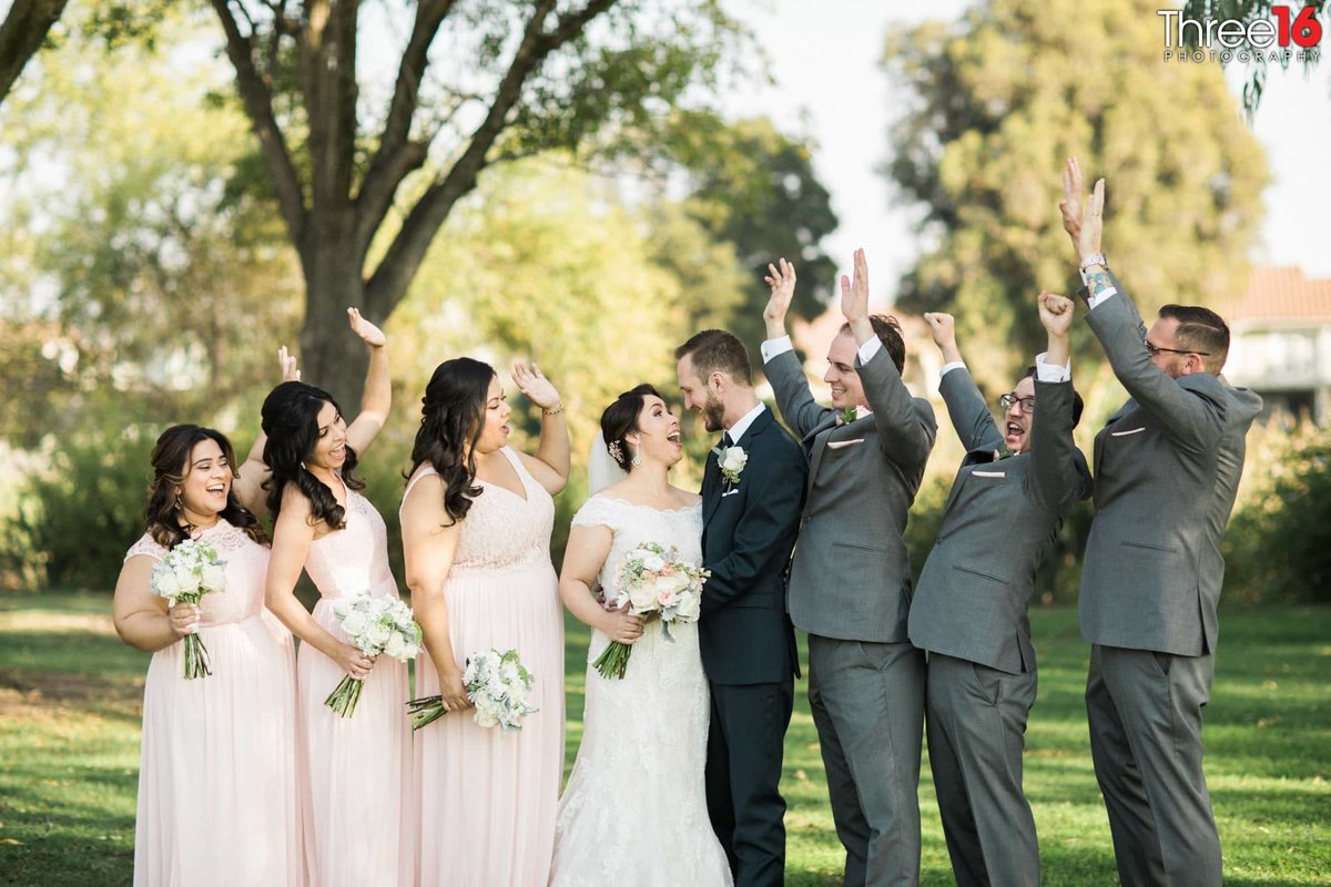 Bridal Party cheers the Bride and Groom