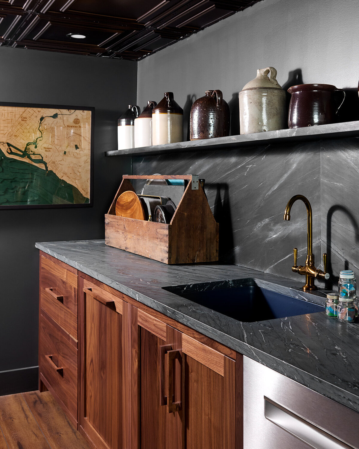 dark gray kitchen counter with wooden undersink cabinet