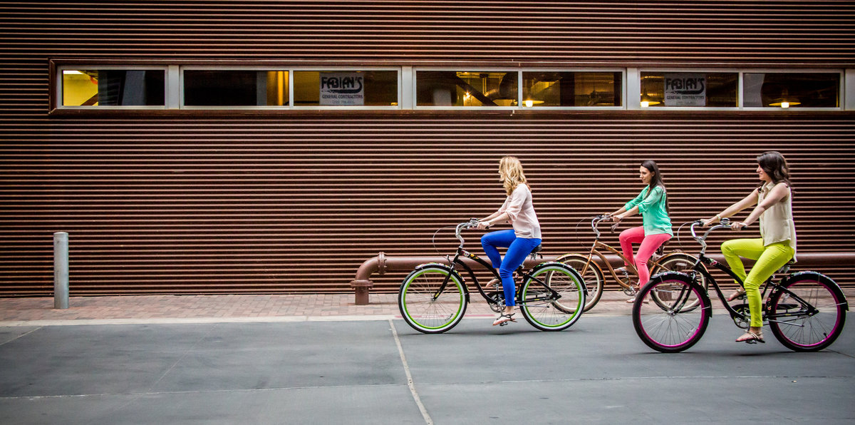 three girls ridding bikes bike at Historic Pearl Brewery in San Antonio by photographer Expose The Heart