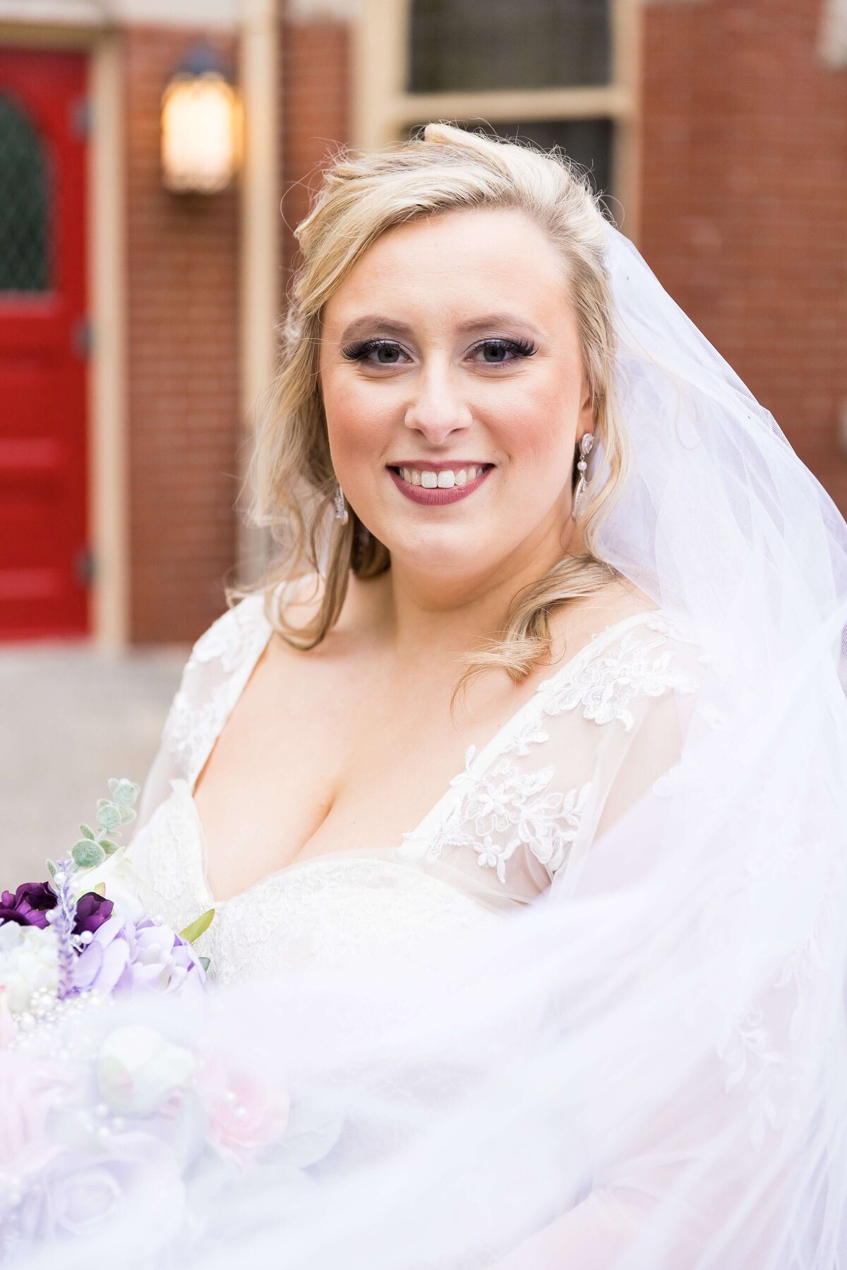 Bride wearing dress designed by Melissa Sweet