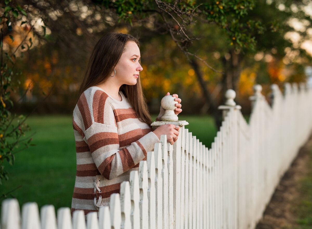 Celebrate your high school senior with personalized portrait sessions, including cap and gown photos, by Leslie Q Photography. Offering both studio and outdoor options to capture their unique personality and milestone. Serving Michiana, Northern Indiana, South Bend, New Carlisle, and surrounding areas.
