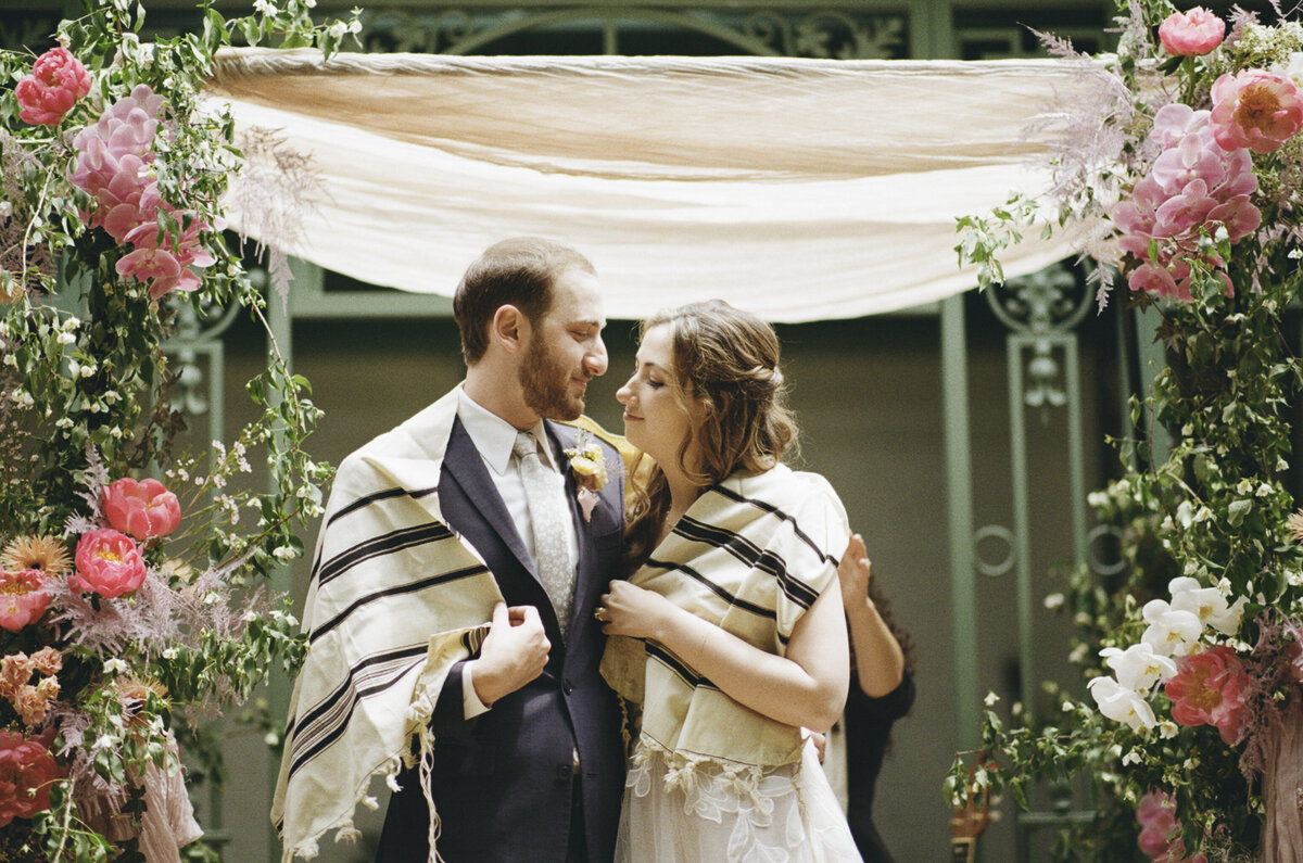 Couple during Jewish ceremony at Milk & Roses micro wedding shot on 35mm film by Hudson Valley wedding photographers