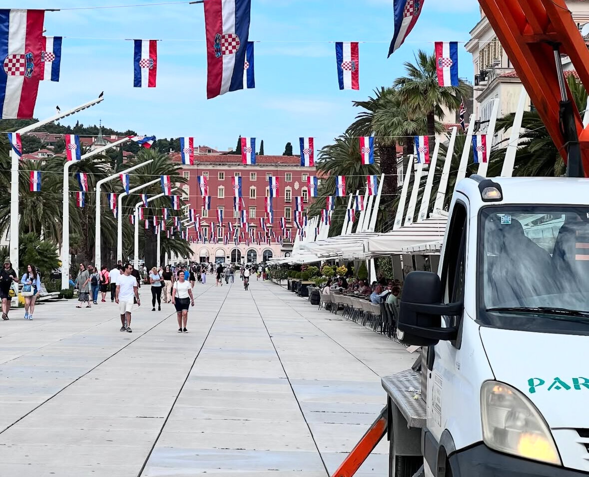 Croatian City with Croatian Flags and tourists